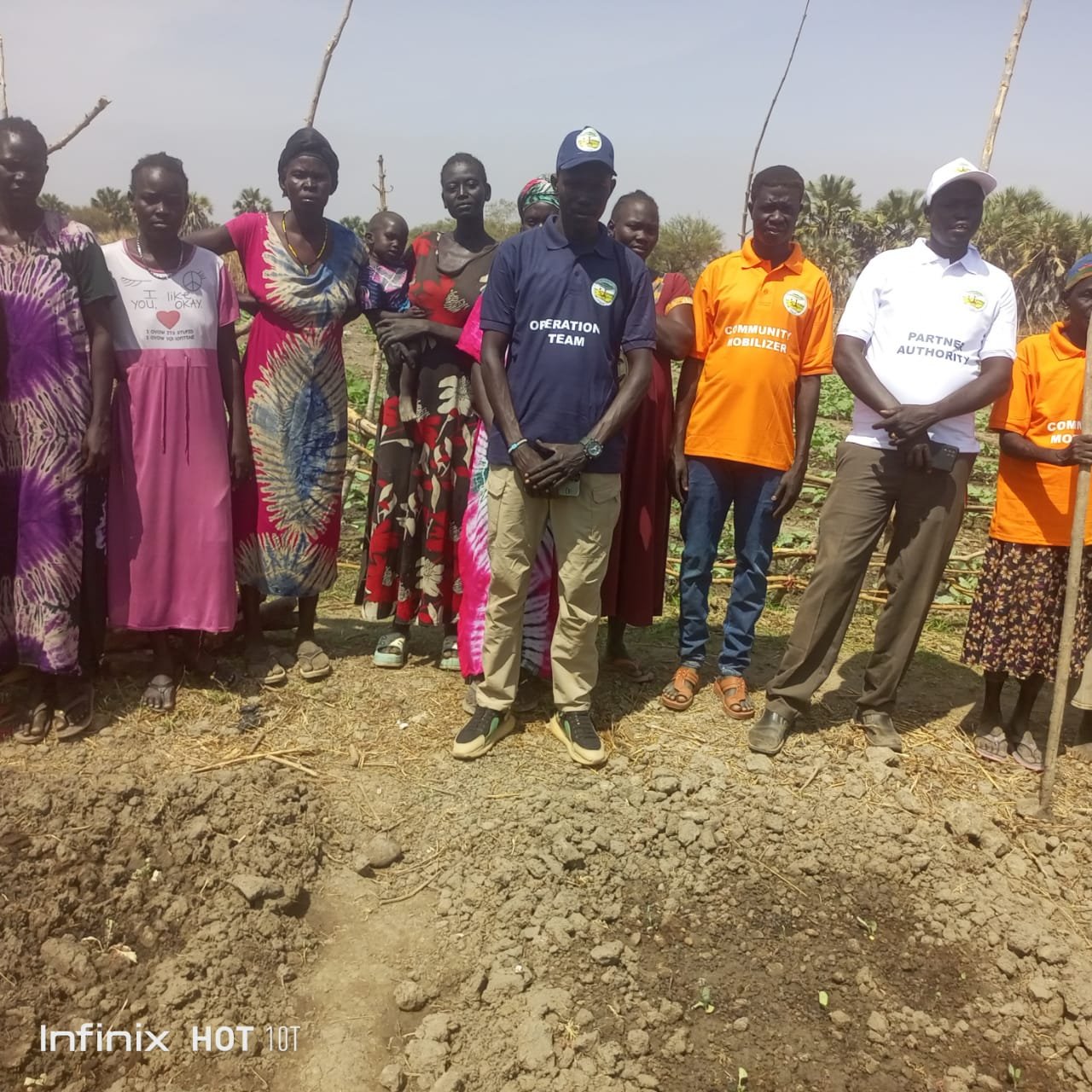 Community members working together in the field